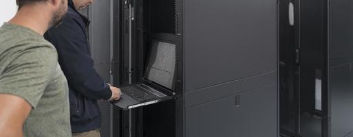 Technicians team updating hardware inspecting system performance in super computer server room or cryptocurrency mining farm. photo