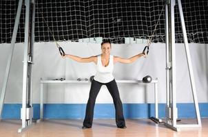 young woman practicing fitness and working out photo