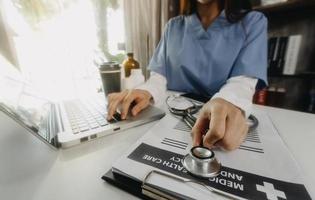 Medicine doctor and stethoscope touching icon medical network connection with modern interface on digital tablet in hospital background. Medical technology network concept photo