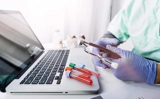 Medicine doctor and stethoscope touching icon medical network connection with modern interface on digital tablet in hospital background. Medical technology network concept photo