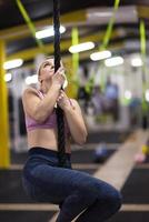 woman doing rope climbing photo