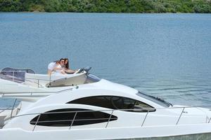 young couple on yacht photo