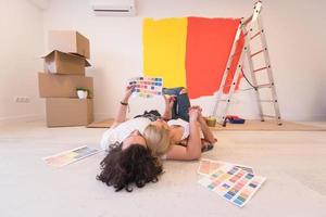 Happy young couple relaxing after painting photo