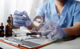 Medicine doctor and stethoscope touching icon medical network connection with modern interface on digital tablet in hospital background. Medical technology network concept photo