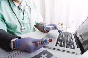 Medicine doctor and stethoscope touching icon medical network connection with modern interface on digital tablet in hospital background. Medical technology network concept photo