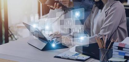 Big data analytics and business intelligence concept with chart and graph icons on a digital screen interface and a businessman hand in background photo