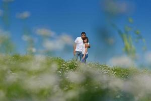 happy couple in wheat field photo