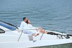 young couple on yacht photo