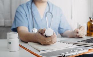 Medicine doctor and stethoscope touching icon medical network connection with modern interface on digital tablet in hospital background. Medical technology network concept photo
