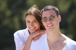 happy couple have fun on the beach photo