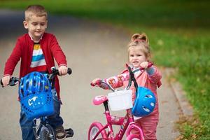 boy and girl with bicycle photo