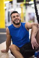 man relaxing before rope climbing photo