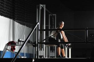 young woman practicing fitness and working out photo