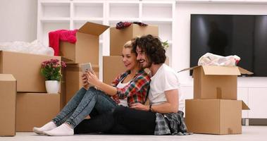 young couple moving  in new house photo