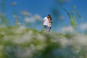 happy couple in wheat field photo