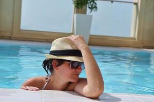 Happy woman in swimming pool photo