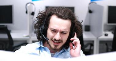 male call centre operator doing his job photo