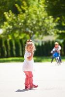 little girl have fun in park photo