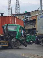 Jakarta, Indonesia on July 2022. A trailer truck had an accident while making a U-turn photo