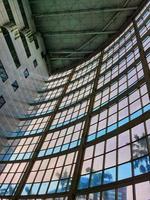 West Java, Indonesia on July 2022. The inside of a tall building, lots of glass and very futuristic. photo