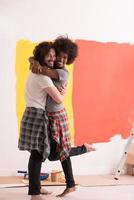 Young happy multiethnic couple hugging photo