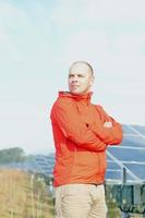 Male solar panel engineer at work place photo