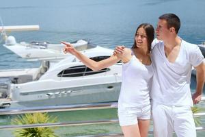 young couple on yacht photo