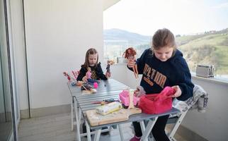 little girls playing with dolls photo