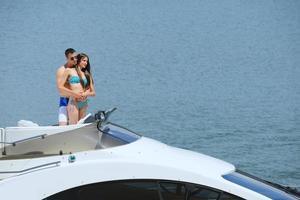 young couple on yacht photo
