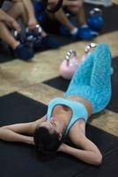 young athlete woman lying on the floor and relaxing photo