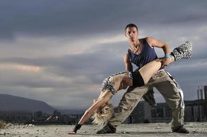 romantic urban couple dancing outdoor photo