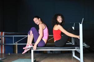 two women work out  in fitness club photo