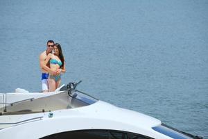 young couple on yacht photo