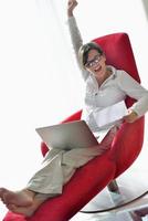 woman using a laptop computer at home photo