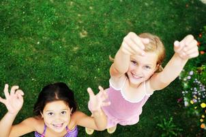 two happy girls have fun outdoor photo