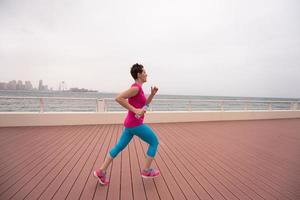 woman running on the promenade photo