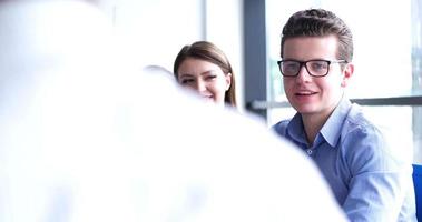 group of business people having a meeting in bright office photo