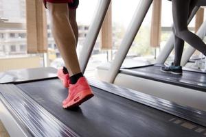 sportsman exercise jogging on treadmill photo