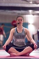 sportswoman doing yoga exercise and meditating photo