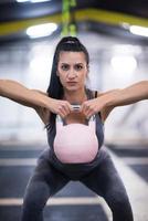 woman exercise with fitness kettlebell photo