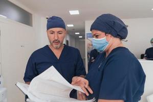 orthopedic doctor working together with his multiethnic team photo