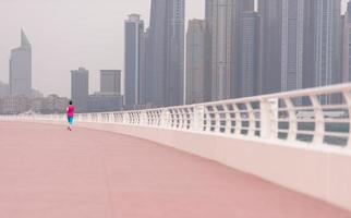 woman running on the promenade photo