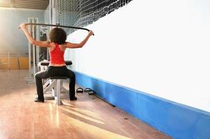 young woman practicing fitness photo