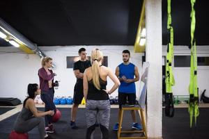 athletes getting instructions from trainer photo