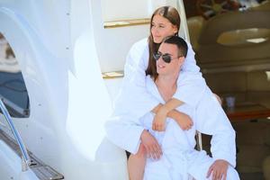 young couple on yacht photo