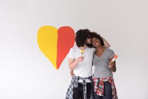 couple with painted heart on wall photo