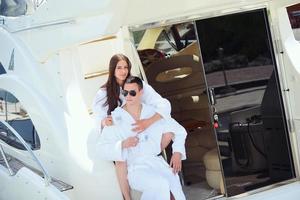 young couple on yacht photo