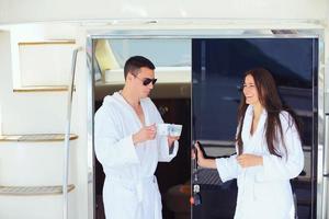 young couple on yacht photo