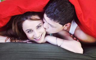 young couple in bed photo