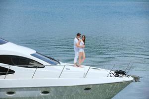 young couple on yacht photo